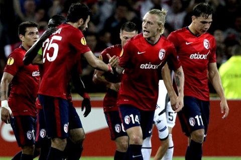 Lille's players react after scoring during their Europa League  soccer match against FC Krasnodar at the Lille Metropole stadium, in Villeneuve d'Ascq, northern France, Thursday, Sept. 18, 2014. (AP Photo/Michel Spingler)