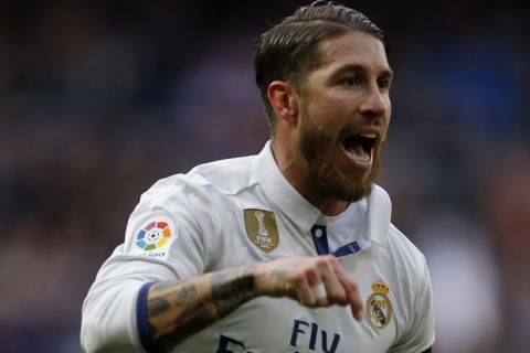 Real Madrid's Sergio Ramos celebrates after scoring a goal against Malaga during a Spanish La Liga soccer match between Real Madrid and Malaga at the Santiago Bernabeu stadium in Madrid, Saturday, Jan. 21, 2017. Ramos scored twice in Real Madrid's 2-1 victory. (AP Photo/Francisco Seco)