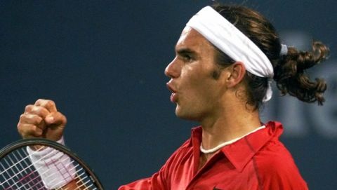 Roger Federer, of Switzerland, pumps his fist after beating Daniel Nestor, of Canada, during their singles match at the U.S. Open tennis tournament Friday evening, Sept. 1, 2000, in New York. Federer won 6-1, 7-6 (5), 6-1. (AP Photo/Ed Betz)
