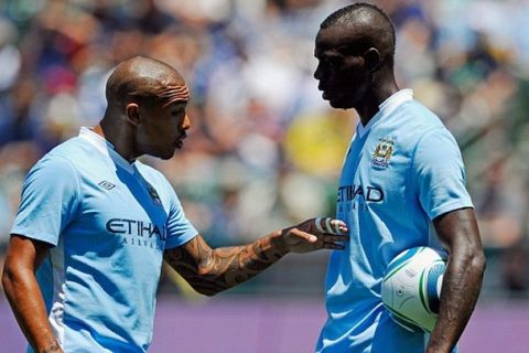 CARSON, CA - JULY 24:  Nigel de Jong #34 of Manchester City speaks with teammate Mario Balotelli #45 before he scored on a penalty kick against Los Angeles Galaxy during the Herbalife World Football Challenge 2011 at the Home Depot Center on July 24, 2011 in Carson, California.  (Photo by Kevork Djansezian/Getty Images)