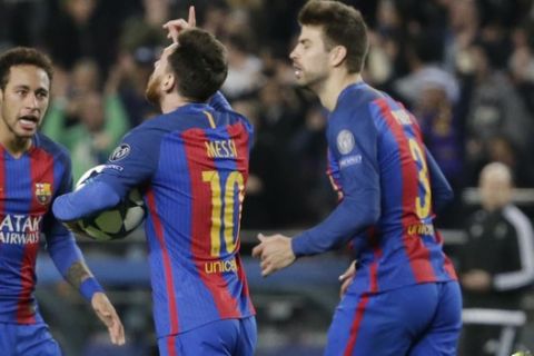 Barcelona's Lionel Messi, center, celebrates after scoring on a penalty, flanked by his teammates Neymar, left and Gerard Pique, during the Champions League round of 16, second leg soccer match between FC Barcelona and Paris Saint Germain at the Camp Nou stadium in Barcelona, Spain, Wednesday March 8, 2017. (AP Photo/Emilio Morenatti)