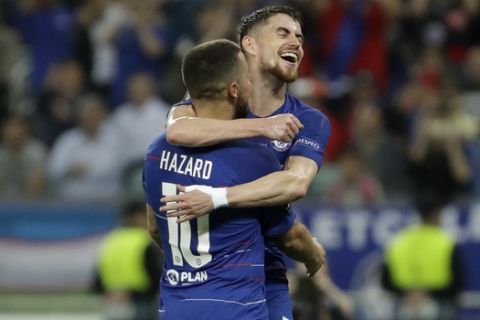 Chelsea's Eden Hazard, left, celebrates after scoring his side's third goal with his teammate Chelsea's Jorginho during the Europa League Final soccer match between Arsenal and Chelsea at the Olympic stadium in Baku, Azerbaijan, Wednesday, May 29, 2019. (AP Photo/Luca Bruno)