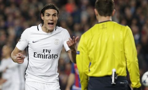 PSG's Edinson Cavani argues with the fourth referee during the Champion's League round of 16, second leg soccer match between FC Barcelona and Paris Saint Germain at the Camp Nou stadium in Barcelona, Spain, Wednesday March 8, 2017. (AP Photo/Emilio Morenatti)