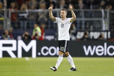 Germany's Lukas Podolski leaves the pitch during the friendly soccer match between Germany and England, which is Podolski's last mach in the national team, in Dortmund, Germany, Wednesday, March 22, 2017. (AP Photo/Frank Augstein)