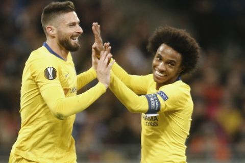 Chelsea's Olivier Giroud celebrates with his teammates Chelsea's Willian after scoring his side's second goal during the Europa League round of 16, second leg soccer match between Dynamo Kiev and Chelsea at the Olympiyskiy stadium in Kiev, Ukraine, Thursday, March 14, 2019. (AP Photo/Efrem Lukatsky)
