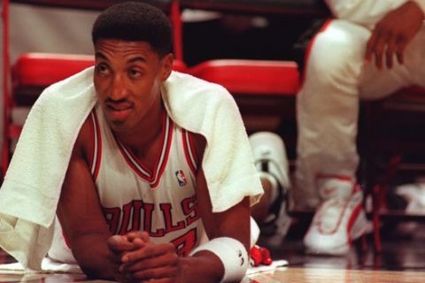 Chicago Bulls forward Scottie Pippen lies in front of the Bulls' bench during the first half against the Charlotte Hornets on Friday, Nov. 3, 1995, in Chicago. Pippen left Friday night's game in the second quarter because of a pulled groin. The Bulls won 105-91.(AP Photo/Beth A. Keiser)