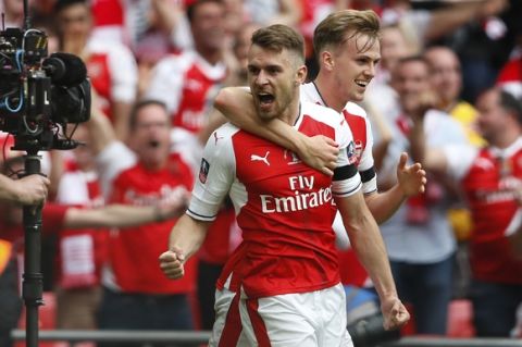 Arsenal's Aaron Ramsey celebrates after scoring his side's second goal during the English FA Cup final soccer match between Arsenal and Chelsea at Wembley stadium in London, Saturday, May 27, 2017. (AP Photo/Kirsty Wigglesworth)