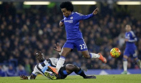 Chelsea's Willian, right, competes for the ball with Newcastle United's Cheick Tiote during the English Premier League soccer match between Chelsea and Newcastle United at Stamford Bridge stadium in London, Saturday, Feb. 13, 2016.  (AP Photo/Matt Dunham)