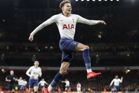 Tottenham's Dele Alli celebrates after scoring his side's second goal during the English League Cup quarter final soccer match between Arsenal and Tottenham Hotspur at the Emirates stadium in London, Wednesday, Dec. 19, 2018. (AP Photo/Frank Augstein)