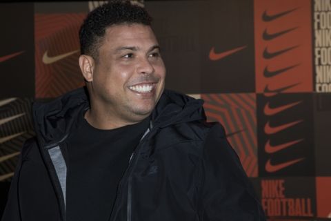 Former soccer player Ronaldo poses for photographers upon arrival at the Nike Celebrates The Beautiful Game event, in London, Wednesday, Feb. 7, 2018. (Photo by Vianney Le Caer/Invision/AP)