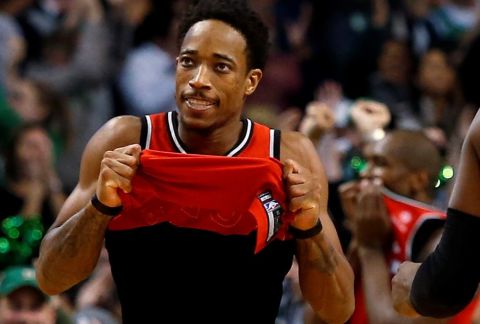 Toronto Raptors' DeMar DeRozan lifts up his jersey after missing a shot in the final seconds of their 95-94 loss to the Boston Celtics in an NBA basketball game in Boston, Sunday, Nov. 12, 2017. (AP Photo/Winslow Townson)