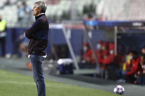 Barcelona's head coach Quique Setien watches from the sideline during the Champions League quarterfinal soccer match between Barcelona and Bayern Munich in Lisbon, Portugal, Friday, Aug. 14, 2020. (Rafael Marchante/Pool via AP)