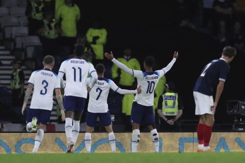 England's Jude Bellingham, second right, celebrates after scoring his side's opening goal during the international friendly soccer match between Scotland and England at the Hampden Park stadium in Glasgow, Scotland, Thursday, Sept. 12, 2023. (AP PhotoScott Heppell)
