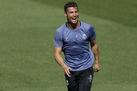 Real Madrid's Cristiano Ronaldo reacts during a training session at the Valdebebas stadium, in Madrid, Monday, April 17, 2017 prior to the Champions League quarterfinal second leg soccer match between FC Bayern Munich and Real Madrid. Real will face Munich on Tuesday.(AP Photo/Daniel Ochoa de Olza)
