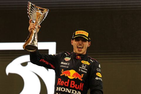 ABU DHABI, UNITED ARAB EMIRATES - DECEMBER 12: Race winner and 2021 F1 World Drivers Champion Max Verstappen of Netherlands and Red Bull Racing celebrates on the podium during the F1 Grand Prix of Abu Dhabi at Yas Marina Circuit on December 12, 2021 in Abu Dhabi, United Arab Emirates. (Photo by Kamran Jebreili - Pool/Getty Images) // Getty Images / Red Bull Content Pool  // SI202112120404 // Usage for editorial use only // 