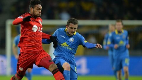 Bayer Leverkusen's German defender from Jonathan Tah (L) vies for the ball with BATE Borisov's Belarusian forward Mikhail Gordeychuk during the UEFA Champions League group E football match between FC BATE Borisov and Bayer 04 Leverkusen at the Borisov Arena stadium in Borisov, outside Minsk, on November 24, 2015. AFP PHOTO / MAXIM MALINOVSKY / AFP / MAXIM MALINOVSKY        (Photo credit should read MAXIM MALINOVSKY/AFP/Getty Images)