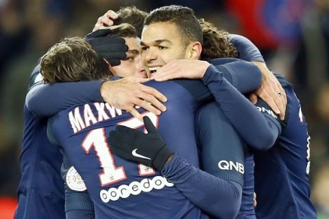 PSG's Hatem Ben Arfa, center, reacts with teammates after scoring the fourth goal during their French League One soccer match between PSG and Marseille at the Parc des Princes stadium in Paris, France, Sunday, Nov. 6, 2016. (AP Photo/Francois Mori)