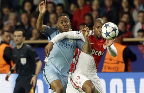 Manchester City's Raheem Sterling, left, challenges for the ball with Monaco's Djibril Sidibe during a Champions League round of 16 second leg soccer match between Monaco and Manchester City at the Louis II stadium in Monaco, Wednesday March 15, 2017. (AP Photo/Claude Paris)