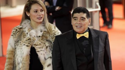 Argentinian soccer legend Diego Maradona and his girlfriend Rocio Oliva arrive for the 2018 soccer World Cup draw in the Kremlin in Moscow, Friday, Dec. 1, 2017. (AP Photo/Dmitri Lovetsky)