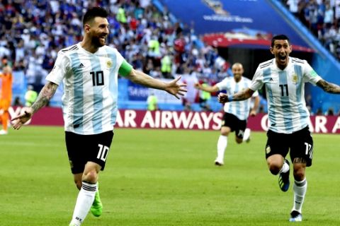 Argentina's Lionel Messi, left, and Argentina's Angel Di Maria, right, celebrate after Argentina's Gabriel Mercado scored their side's second goal during the round of 16 match between France and Argentina, at the 2018 soccer World Cup at the Kazan Arena in Kazan, Russia, Thursday, June 28, 2018. (AP Photo/Ricardo Mazalan)