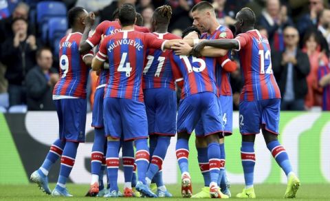 Crystal Palace's Joel Ward celebrates scoring his side's first goal of the game with his team during their English Premier League match against Wolverhampton Wanderers at Selhurst Park, London, Sunday, Sept. 22, 2019. (Daniel Hambury/PA via AP)