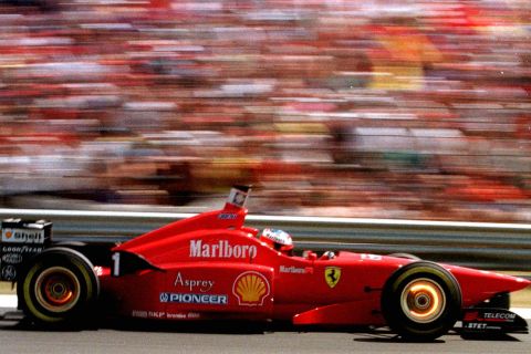 FILE - In this Saturday August 10 1996 file photo, Germany's Michael Schumacher drives his Ferrari to set the best time and take pole position for the Hungarian Grand Prix in Budapest. Schumacher's arrival at Ferrari in 1996 marked a turning point for the team, though it would take another four years before he added to his previous two world titles and ended Ferrari's 21-year title drought. He is the most successful driver of all time having won the world title on seven occasions, five with Ferrari. Ferrari's symbol on the New York Stock Exchange says it all - RACE. (AP Photo/Dusan Vranic, File)