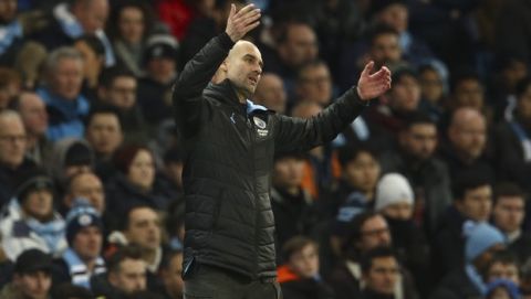 Manchester City's head coach Pep Guardiola gestures during the English League Cup semifinal second leg soccer match between Manchester City and Manchester United at Etihad stadium in Manchester, England, Wednesday, Jan. 29, 2020. (AP Photo/Dave Thompson)