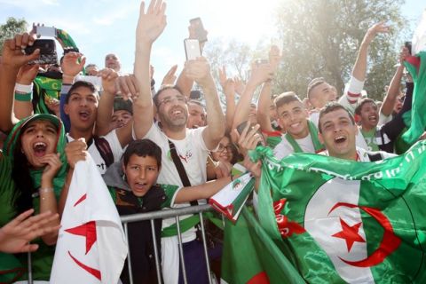 SION, SWITZERLAND - MAY 31: Fans of of Algeria celebrate the arrival of their team prior to the international friendly match between Algeria and Armenia at Estadio Tourbillon on May 31, 2014 in Sion, Switzerland. (Photo by Philipp Schmidli/Getty Images)