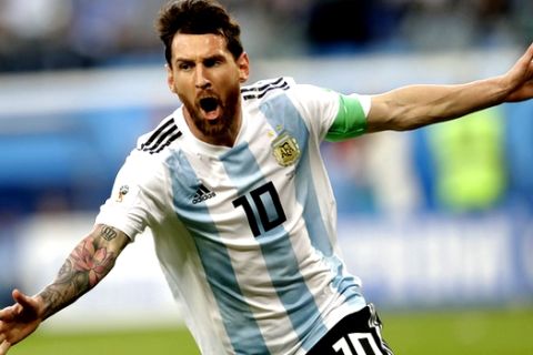 Argentina's Lionel Messi celebrates after scoring the opening goal of his team during the group D match between Argentina and Nigeria, at the 2018 soccer World Cup in the St. Petersburg Stadium in St. Petersburg, Russia, Tuesday, June 26, 2018. (AP Photo/Petr David Josek)