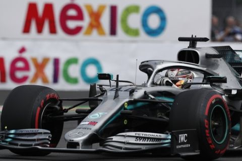 Mercedes driver Lewis Hamilton, of Britain, competes in the qualifying session for the Formula One Mexico Grand Prix auto race at the Hermanos Rodriguez racetrack in Mexico City, Saturday, Oct. 26, 2019. (AP Photo/Rebecca Blackwell)