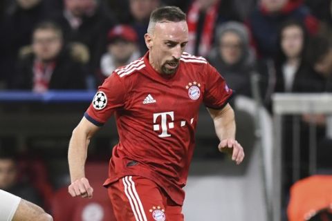 Bayern midfielder Franck Ribery, right, duels for the ball with Liverpool midfielder Fabinho during the Champions League round of 16 second leg soccer match between Bayern Munich and Liverpool at the Allianz Arena, in Munich, Germany, Wednesday, March 13, 2019. (AP Photo/Kerstin Joensson)