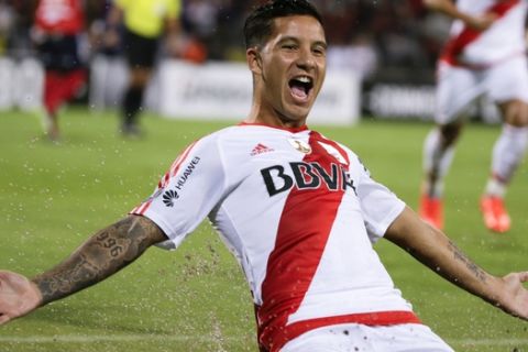 Sebastian Driussi of Argentina's River Plate celebrates scoring his side's 2nd goal against Colombia's Deportivo Independiente Medellin during a Copa Libertadores Group 3 soccer match at the Atanasio Girardot stadium in Medellin, Colombia, Wednesday, March 15, 2017. (AP Photo/Ricardo Mazalan)
