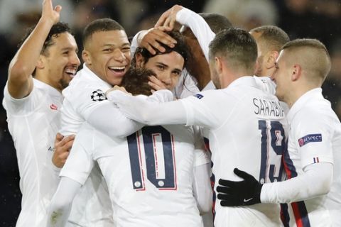 PSG's Edinson Cavani, center, celebrates after scoring his side's fifth goal during the Champions League group A soccer match between PSG and Galatasaray at the Parc des Princes stadium in Paris, Wednesday, Dec. 11, 2019. (AP Photo/Christophe Ena)