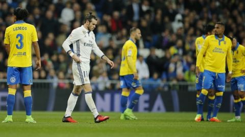 Real Madrid's Gareth Bale, second left, walks off after receiving a red card during a Spanish La Liga soccer match between Real Madrid and Las Palmas at the Santiago Bernabeu stadium in Madrid, Spain, Wednesday March 1, 2017. (AP Photo/Paul White)