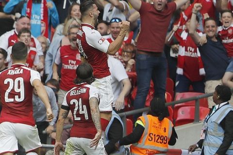 Arsenal players celebrate after scoring during the English Community Shield soccer match between Arsenal and Chelsea at Wembley Stadium in London, Sunday, Aug. 6, 2017. (AP Photo/Frank Augstein)