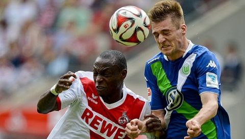 Cologne's striker Anthony Ujah and Wolfsburg's Robin Knoche (R) vie for the ball during German first division Bundesliga football match 1 FC Cologne vs VfL Wolfsburg at the RheinEnergieStadion in Cologne, western Germany on May 23, 2015.  AFP PHOTO / SASCHA SCHUERMANN

RESTRICTIONS - DFL RULES TO LIMIT THE ONLINE USAGE DURING MATCH TIME TO 15 PICTURES PER MATCH. IMAGE SEQUENCES TO SIMULATE VIDEO IS NOT ALLOWED AT ANY TIME. FOR FURTHER QUERIES PLEASE CONTACT DFL DIRECTLY AT + 49 69 650050.        (Photo credit should read SASCHA SCHUERMANN/AFP/Getty Images)