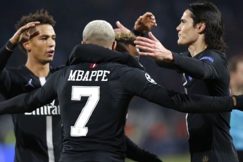 PSG players celebrate their team's fourth goal during a Champions League Group C soccer match between Red Star and Paris Saint Germain, in Belgrade, Serbia, Tuesday, Dec. 11, 2018. (AP Photo/Marko Drobnjakovic)