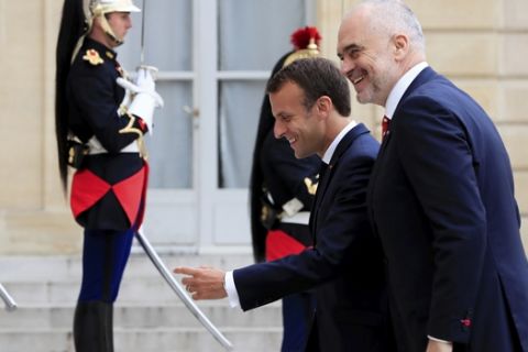 French President Emmanuel Macron, left, welcomes Albanian Prime Minister Edi Rama before a meeting at the Elysee Palace in Paris, Tuesday, May 15, 2018. (Gonzalo Fuentes, Pool via AP)
