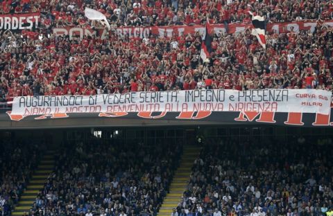 Milan's fans show a banner welcoming the team's new Chinese owners during an Italian Serie A soccer match between Inter Milan and AC Milan, at the San Siro stadium in Milan, Italy, Saturday, April15, 2017. (AP Photo/Antonio Calanni)