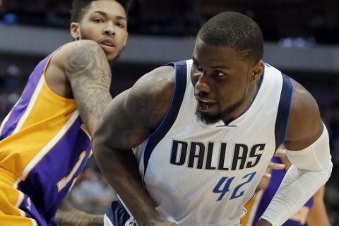 Dallas Mavericks' Ben Bentil (42) of Ghana positions for a shot as Los Angeles Lakers' Tyler Ennis defends in the second half of an NBA basketball game in Dallas, Tuesday, March 7, 2017. (AP Photo/Tony Gutierrez)