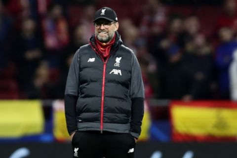 Liverpool's manager Jurgen Klopp smiles before a 1st leg, round of 16, of the Champions League soccer match between Atletico Madrid and Liverpool at the Wanda Metropolitano stadium in Madrid, Tuesday Feb. 18, 2020. (AP Photo/Manu Fernandez)