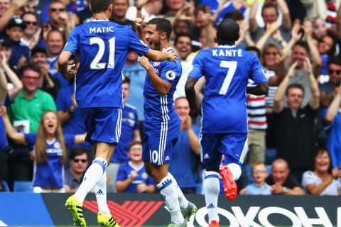 LONDON, ENGLAND - AUGUST 27: Eden Hazard of Chelsea celebrates scoring his sides first goal with his team mates during the Premier League match between Chelsea and Burnley at Stamford Bridge on August 27, 2016 in London, England.  (Photo by Steve Bardens/Getty Images)