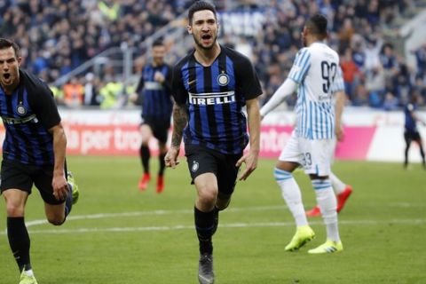 Inter Milan's Matteo Politano, center, celebrates after scoring his side's opening goal during the Serie A soccer match between Inter Milan and Spal at the San Siro Stadium, in Milan, Italy, Sunday, March 10, 2019. (AP Photo/Antonio Calanni)