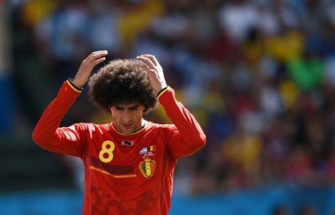 Belgium's midfielder Marouane Fellaini reacts after missing a goal opportunity during a quarter-final football match between Argentina and Belgium at the Mane Garrincha National Stadium in Brasilia during the 2014 FIFA World Cup on July 5, 2014.  AFP PHOTO / PEDRO UGARTE