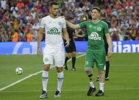 Chapecoense's Follmann, right, and Neto after the honorary kickoff during the Joan Gamper trophy friendly soccer match between FC Barcelona and Chapecoense at the Camp Nou stadium in Barcelona, Spain, Monday, Aug. 7, 2017. (AP Photo/Manu Fernandez)