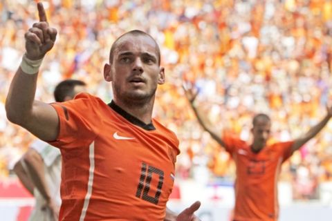FILE - In this Saturday June 5, 2010 file photo Wesley Sneijder of The Netherlands celebrates scoring during the friendly soccer match Netherlands versus Hungary at ArenA stadium in Amsterdam, Netherlands. Midfielder Wesley Sneijder is retiring from international football after 15 years and a record 133 appearances for the Netherlands. The Dutch football association announced the retirement Sunday after new coach Ronald Koeman visited 33-year-old Sneijder in Qatar, where he plays for Al Gharafa. (AP Photo/Peter Dejong)