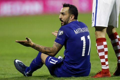 Greece's Kostas Mitroglou reacts during the World Cup qualifying play-off first leg soccer match between Croatia and Greece at Maksimir Stadium in Zagreb, Thursday Nov. 9, 2017. (AP Photo/Darko Bandic)
