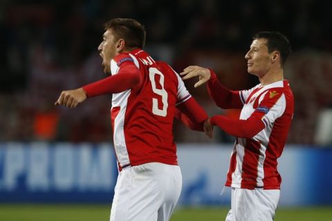 Red Star's Milan Pavkov, left, celebrates after scoring the opening goal of his team during the Champions League group C soccer match between Red Star and Liverpool at Rajko Mitic stadium in Belgrade, Tuesday, Nov. 6, 2018. (AP Photo/Darko Vojinovic)