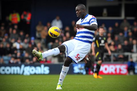 Queens Park Rangers' newly signed Congolese defender Christopher Samba gestures during the English Premier League football match between QPR and Norwich City at Loftus Road in London on February 2, 2013. AFP PHOTO/CARL COURT

== RESTRICTED TO EDITORIAL USE. No use with unauthorized audio, video, data, fixture lists, club/league logos or â??liveâ? services. Online in-match use limited to 45 images, no video emulation. No use in betting, games or single club/league/player publications ==        (Photo credit should read CARL COURT/AFP/Getty Images)