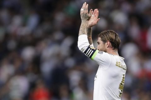 Real Madrid's Sergio Ramos applauds fans at the end of the Champions League group A soccer match between Real Madrid and Club Brugge, at the Santiago Bernabeu stadium in Madrid, Tuesday, Oct.1, 2019. (AP Photo/Manu Fernandez)